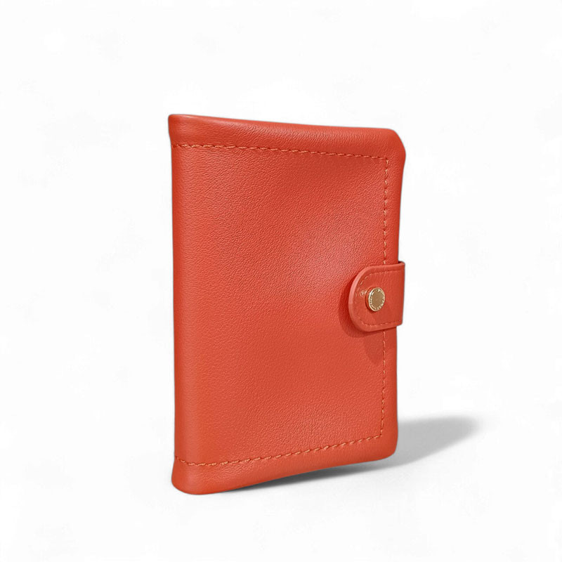 PH26005 Pourchet portefeuille dame en cuir orange photo de face